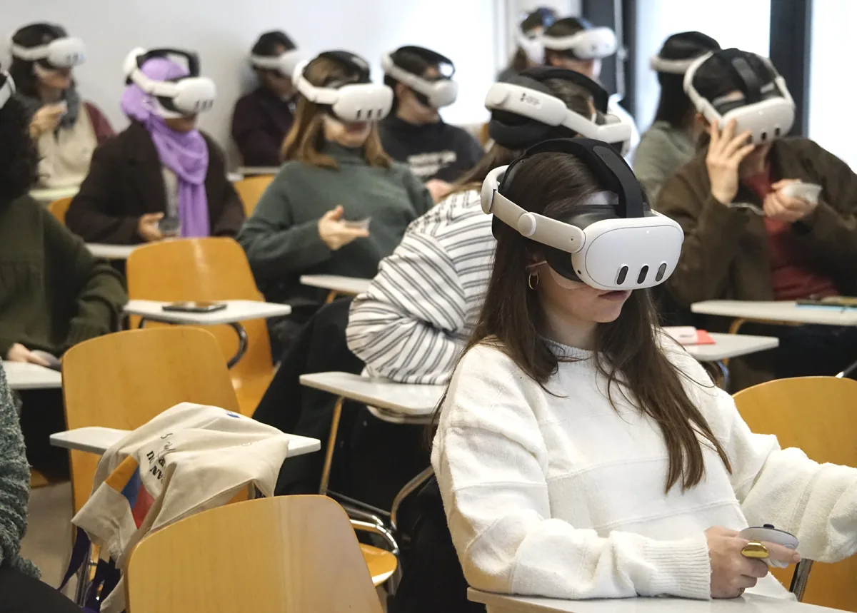A full classroom of students wearing VR headsets during the immersive workshop